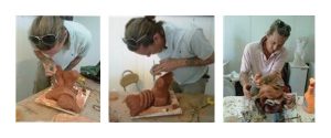 An artist working on carving a clay sculpture