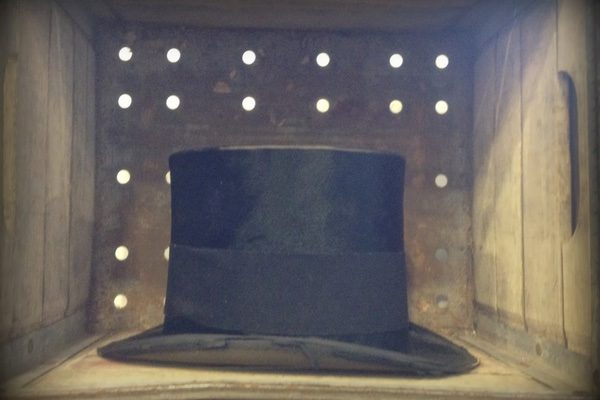 An image of a hat in a box with holes in it