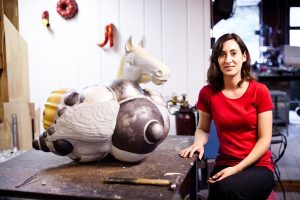 Sculptor Dana Filibert with a piece from her Dreamscape series