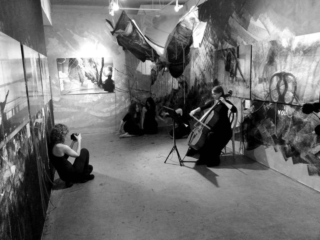 Tatiana Ravero Sanz on the "set" in her studio/bedroom, photographing cellist performance.