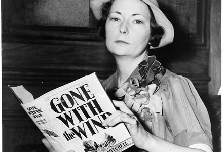 Gone With the Wind author Margaret Mitchell posing with her novel.