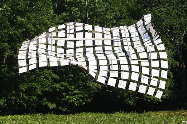 A kinetic sculpture made of a series of large white metal squares