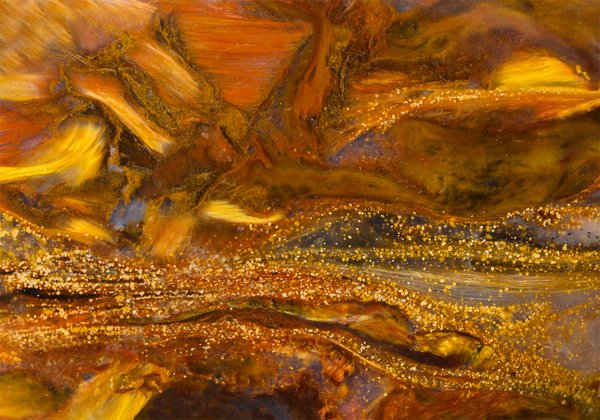 A close-up photograph of an amber crystal