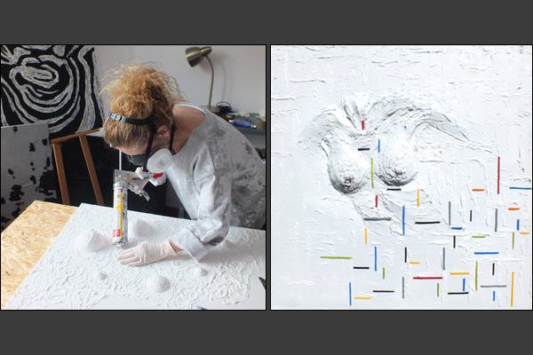 Agnieszka Gzyl at work on one of her paintings with plaster