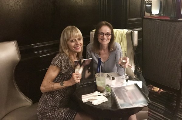 Susan Tepper and Stephanie Dickinson at a table in the Algonquin Hotel