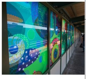 Colorful oil paintings installed on the platform of a subway station