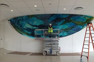Amy Genser at work on one of her large-scale installations