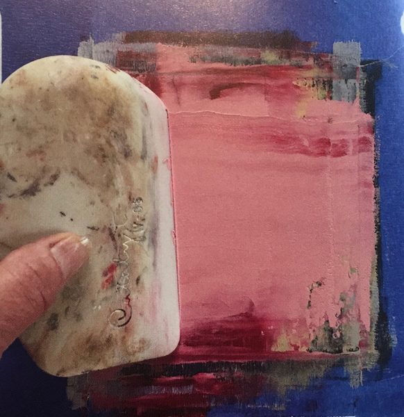 A photograph of a cold wax medium being worked with to create a painting