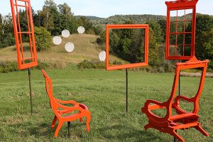 Outdoor deck chairs overlook moveable window frames