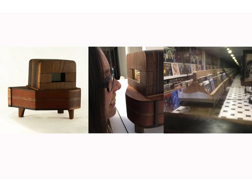 The exterior and interior of a piano-shaped sculpture with a miniature record store model inside