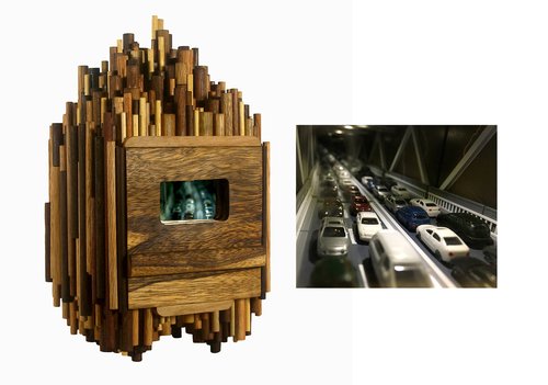 The exterior and interior of a sculpture with a miniature model freeway inside