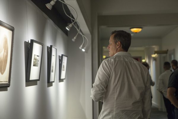 A viewer at an exhibition at the Panopticon Gallery