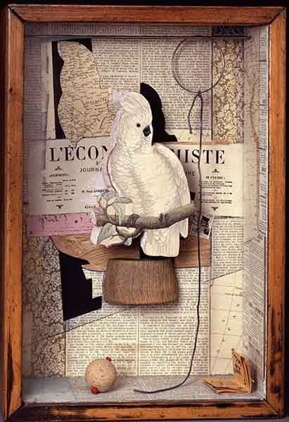 A shadow box of a drawing of a canary on a stick, with collage in the background