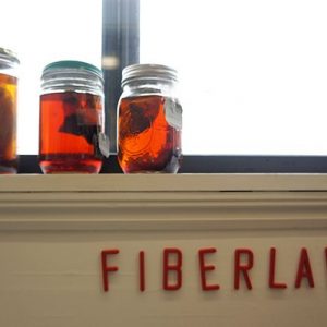 A windowsill with sticker letters spelling Fiberlab under the sill