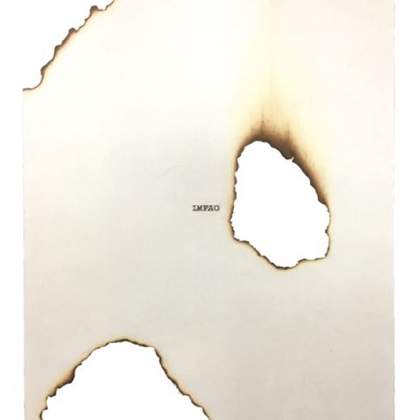 A burned piece of paper with "LMFAO" typed in the center