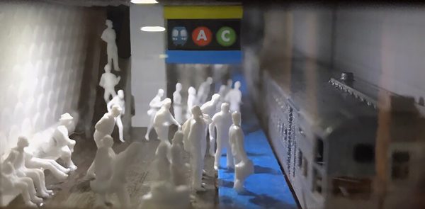 A model of a large number of figures waiting for a subway train