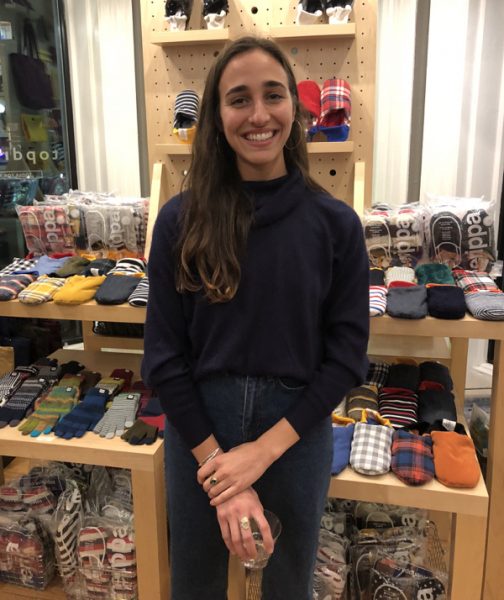 An artist at the store where her work is displayed