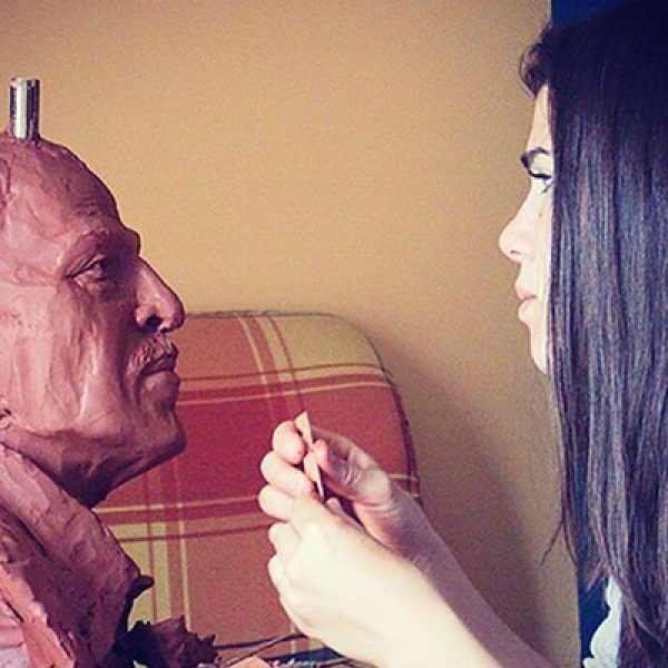 Sculptor Susan Clinard works on a bust