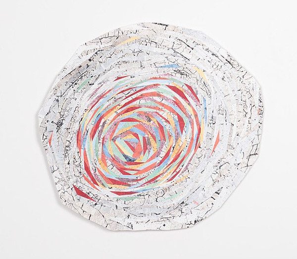 Cut photographs and paintings turned into a spiral-shaped collage