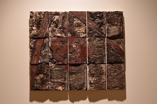 A bible with the ruins of the Monastery of Saint Elijah etched into the cover