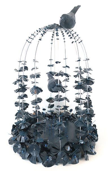 An installation of a bird in a cage