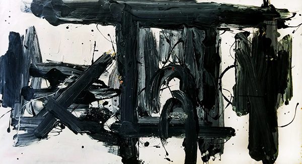 An abstract painting with thick black slabs of paint on a white canvas