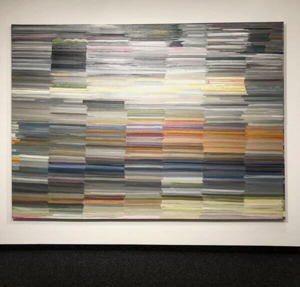 An abstract painting of muted colorful lines