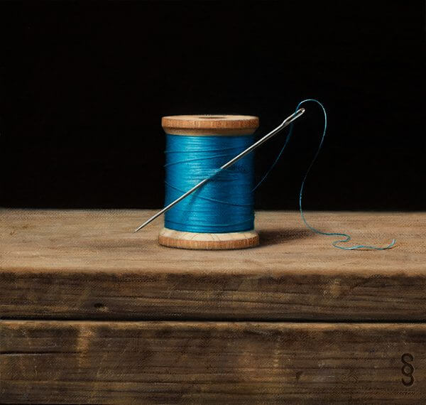 A still life painting of a bright blue bobble of thread with a needle on a wooden table