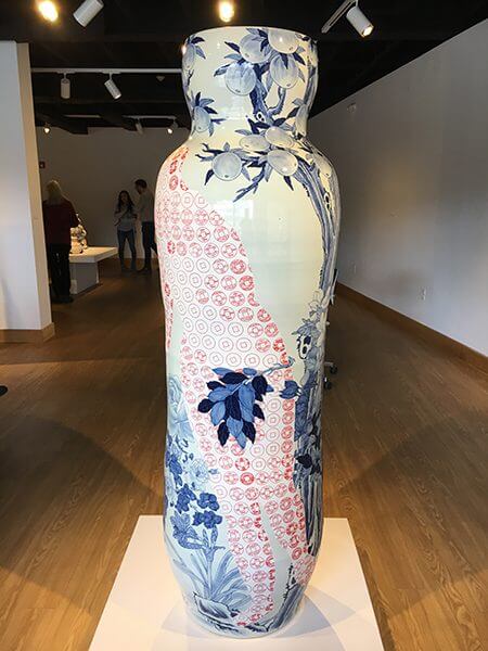 A porcelain painted vase with red and blue 