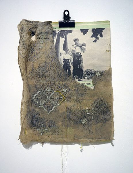 A vintage picture covered by an old fabric cover