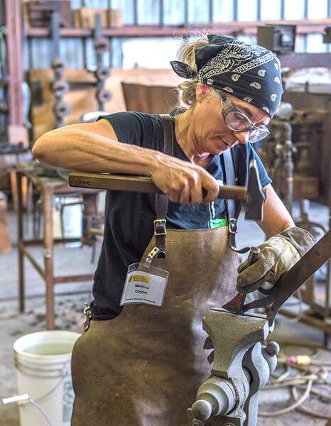 Monica Coyne working on steel