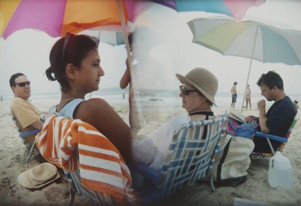 Two photographs melded together of a family at a beach