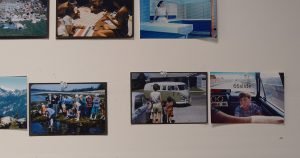 Photographs tacked onto the wall of a photographer's studio