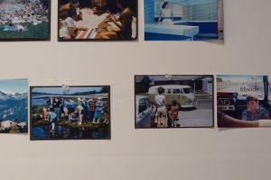 Photographs tacked onto the wall of a photographer's studio