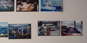 Photographs tacked onto the wall of a photographer's studio