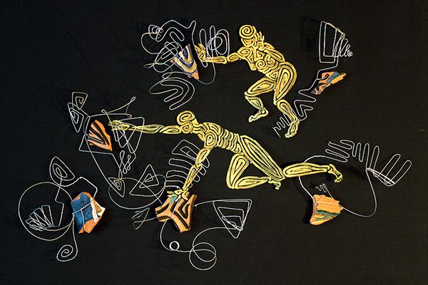A collage of cloth and archival prints sewn together on a black background