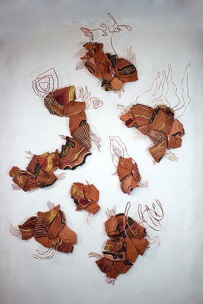 Shards of destroyed pottery installed with copper wire