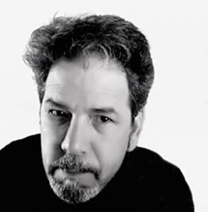 Black and white headshot of artist Greg Skol