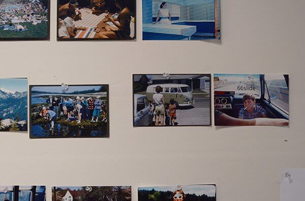 Different styles of photographs hung on the wall of a photographer's studio