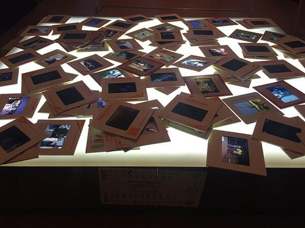 A collection of undeveloped photos on a table 