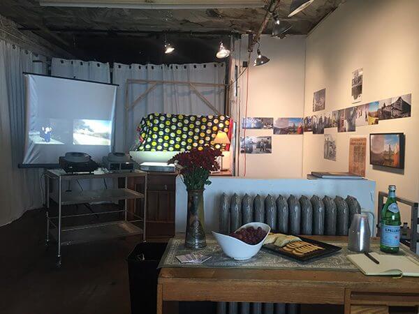 A center table and shelves in a photographer's studio