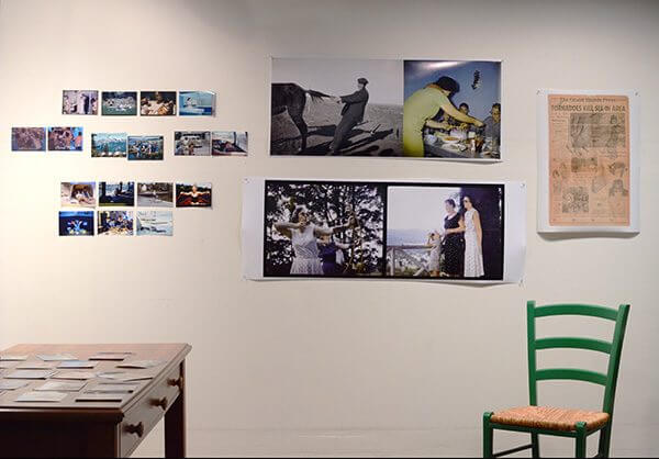 Different styles of photographs hung on the wall of a photographer's studio