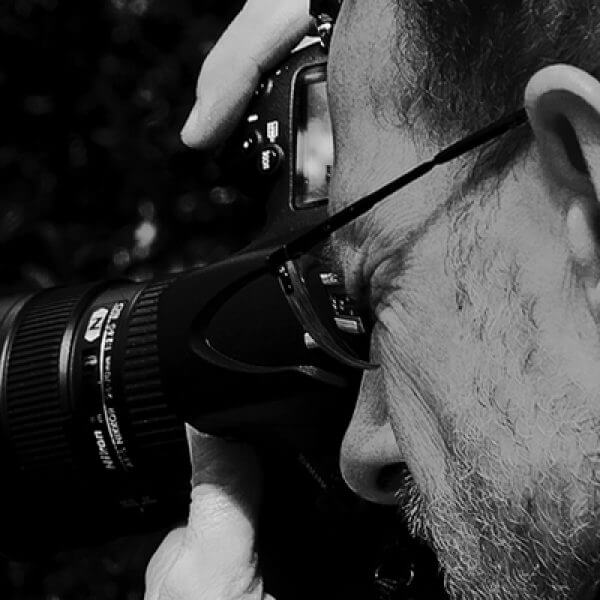 black and white action shot of photographer David Quinn