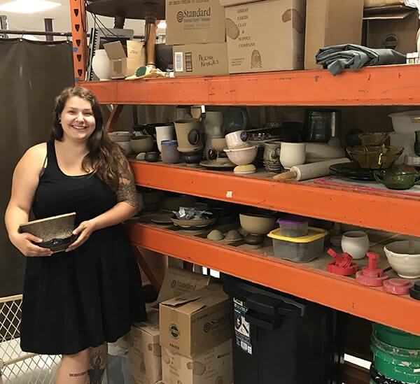 Emily M. Rangel-Cascio and her shelves