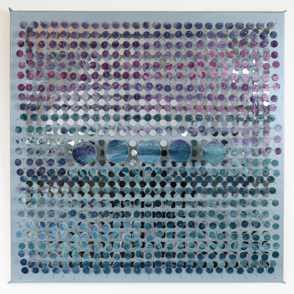 Laurie Borggreve's piece, with small circles of colored metal in front of small mirrors.