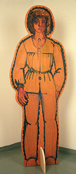 An orange 2-d cutout painting of a person