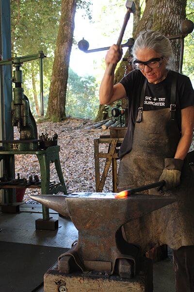 Monica Coyne forges steel at her anvil
