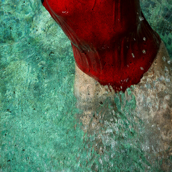 Edited photograph of a swimmer in the pool in a red swimsuit