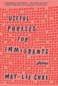 Warm pink book cover titled Useful Phrases for Immigrants