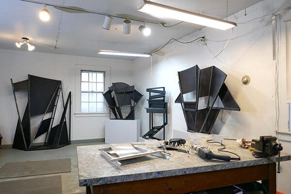 Sets of aluminum painted sculpture in an artist's studio